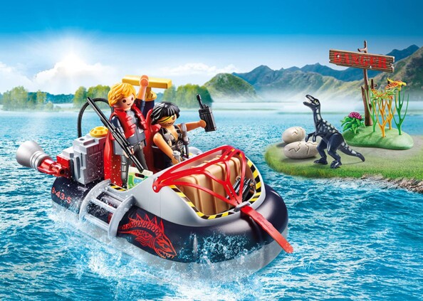 Pack Playmobil avec bateau à moteur, 2 figurines Playmobil, 1 petit dinosaure et plein d'accessoires.