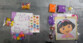 Deux kits d’activités Dora avec perles, stickers et modèles sur carrelage gris