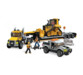 Transporteur de charges lourdes CAT Mega Bloks un grand chantier à construire
